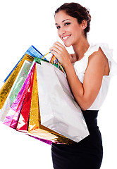 Image showing portrait of pretty young women smiling with shopping bag