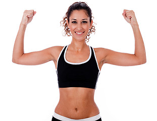 Image showing Woman raising her hands doing exercises