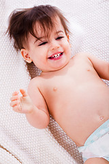 Image showing Baby laughing after the bath in a white towel