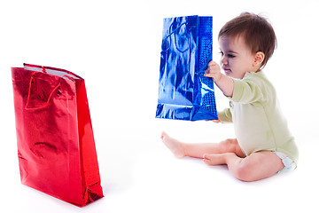 Image showing Baby holding the shopping bag