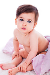 Image showing Little baby bending down and covered with towel