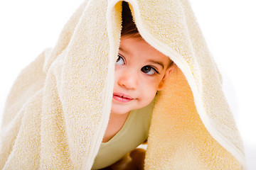 Image showing Baby looking out from under his blanket
