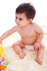 Image showing Toddler sitting with toys