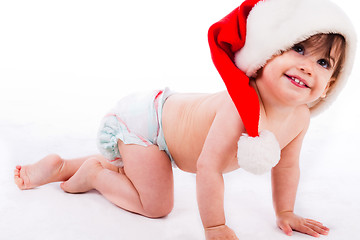 Image showing Baby crawling with santa cap
