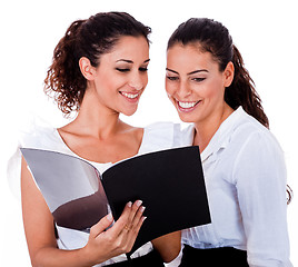 Image showing Young business colleagues looking at the files