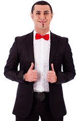 Image showing Young business model posing by adjusting his coat