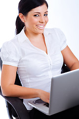Image showing Young attractive business woman smiling while surfing the net
