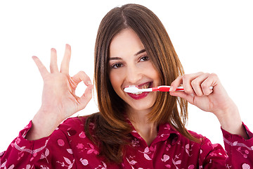 Image showing Women brushing her teeth and showing perfect gesture