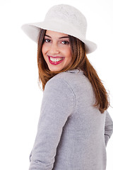 Image showing Young smiling face model wearing a coat and hat