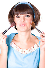 Image showing woman in blue dress with two make-up brushes