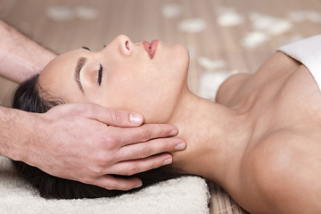 Image showing Happy woman receiving head massage