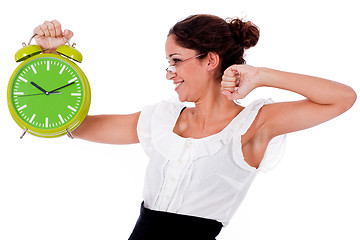 Image showing Shot of a Young business woman holding clock