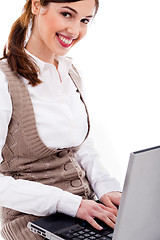 Image showing Cute girl typing on laptop