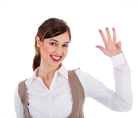 Image showing Beautiful young model raising her hand up and showing four fingers