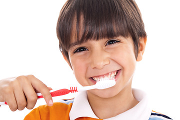 Image showing Closeup of cute kid brushing his teeth