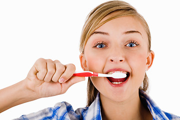 Image showing Young girl the brush her tooth