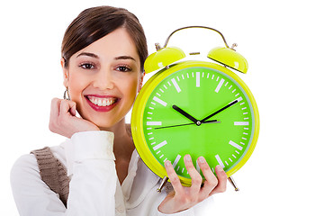 Image showing attractive young model smiling and holding the clock