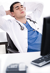 Image showing Young male doctor relaxing at his cabin