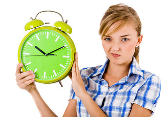 Image showing Girl giving funny expression and holding the alarm