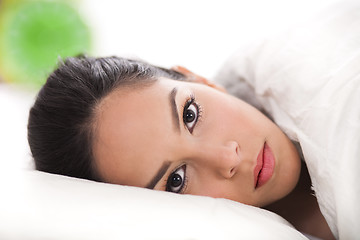 Image showing sexy lady lying in her bed,closeup shot