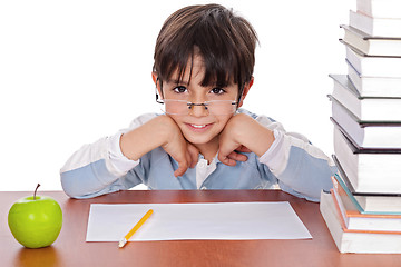 Image showing Studying young boy gives strange look wearing specs