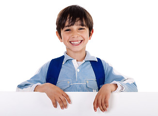 Image showing Smiling young boy behind the blank board