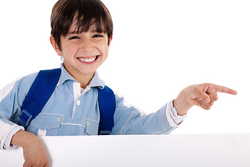 Image showing Happy young boy pointing to copy sapce