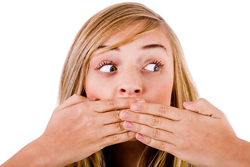 Image showing Closeup of young women covering her mouth with both hands