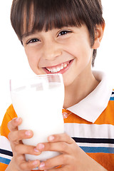 Image showing Happy kid drinking glass of milk