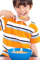 Image showing Young boy having his breakfast