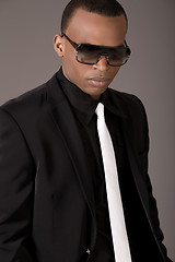 Image showing Serious black business man with sunglasses