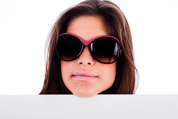 Image showing closeup of beautiful young women showing blank board stright view head