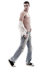 Image showing Stylish model show his chest in open shirt and jean, side pose