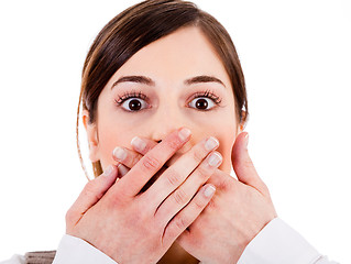 Image showing Closeup of young women covering her mouth with both hands