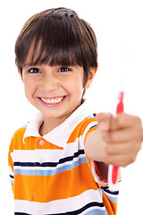 Image showing Boy showing the toothbrush