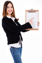 Image showing Business women pointing on a blank clip board