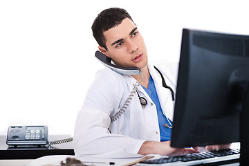 Image showing Doctor logging his notes in computer