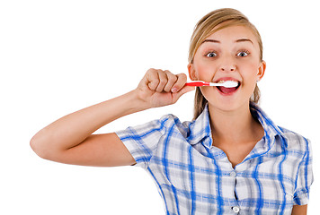 Image showing Women brushing her teeth