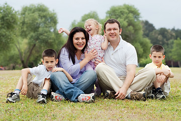 Image showing Portrait of happy family of five on the green land