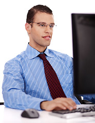 Image showing Business man working on his office