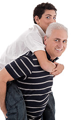 Image showing Grandfather piggybacking his grandson