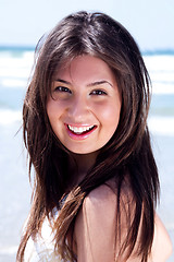 Image showing Close up shot of young beautiful woman looking at you