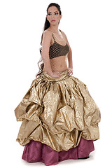 Image showing Beautiful blond belly dancer in golden costume dancing