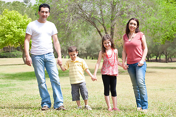 Image showing Family posing to camera in the park