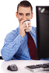 Image showing Business man have a drink on his office