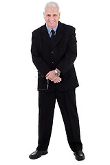 Image showing Isolated handsome mature business man standing