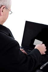 Image showing Senior person looking into his swipe card rear view