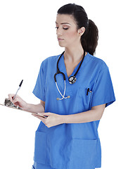 Image showing Friendly nurse making medical notes