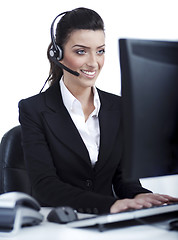 Image showing Woman wearing headset in computer room at her cabin