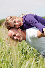 Image showing Man giving his wife a piggyback ride